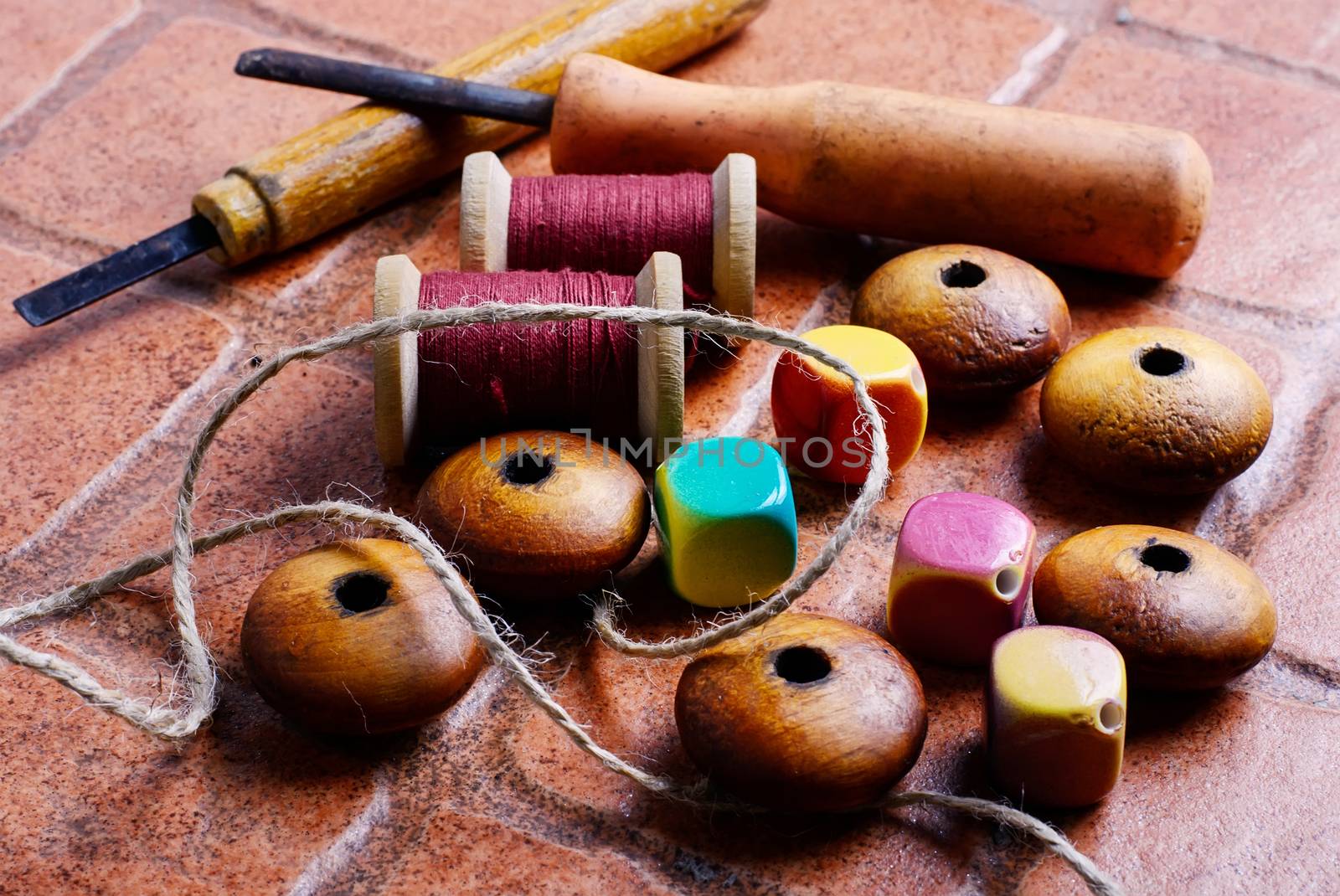 Wooden jewelry beads and tools for needlework at home