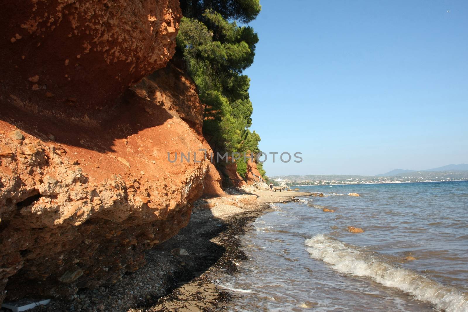 Red rocks on the coast of Aegean Sea close to Nikiti,Greece
