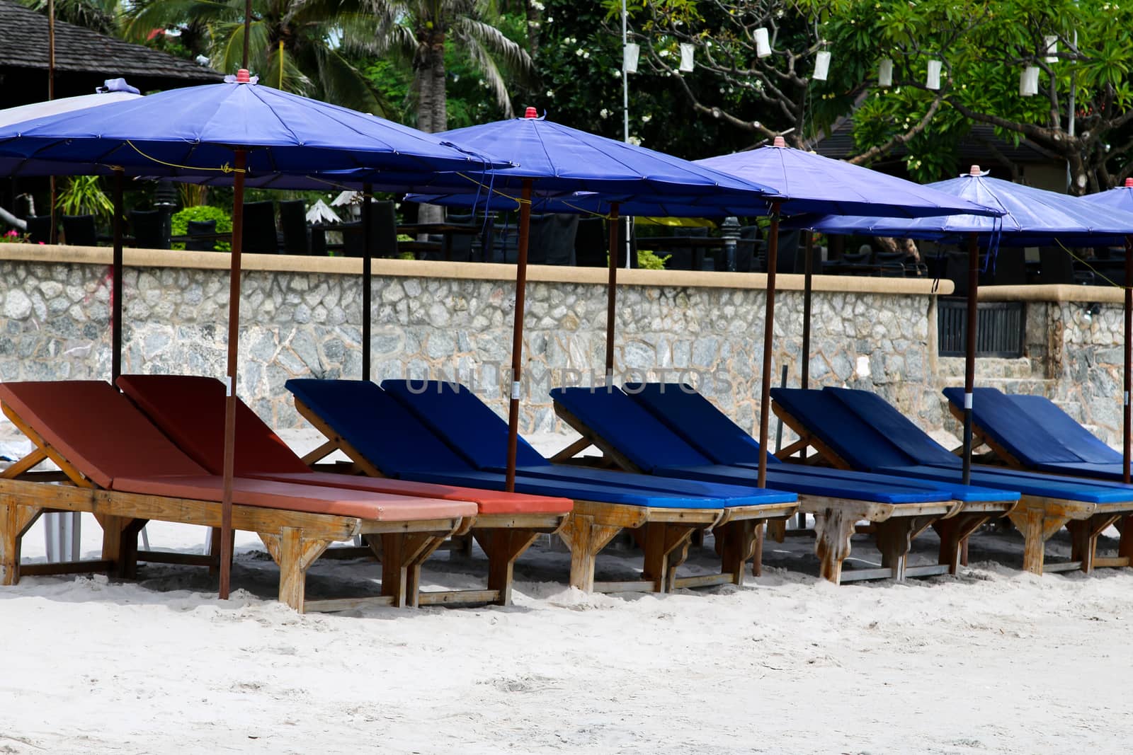 umbrellas and deckchairs against of seascape under blue sky. Beach  Hua Hin