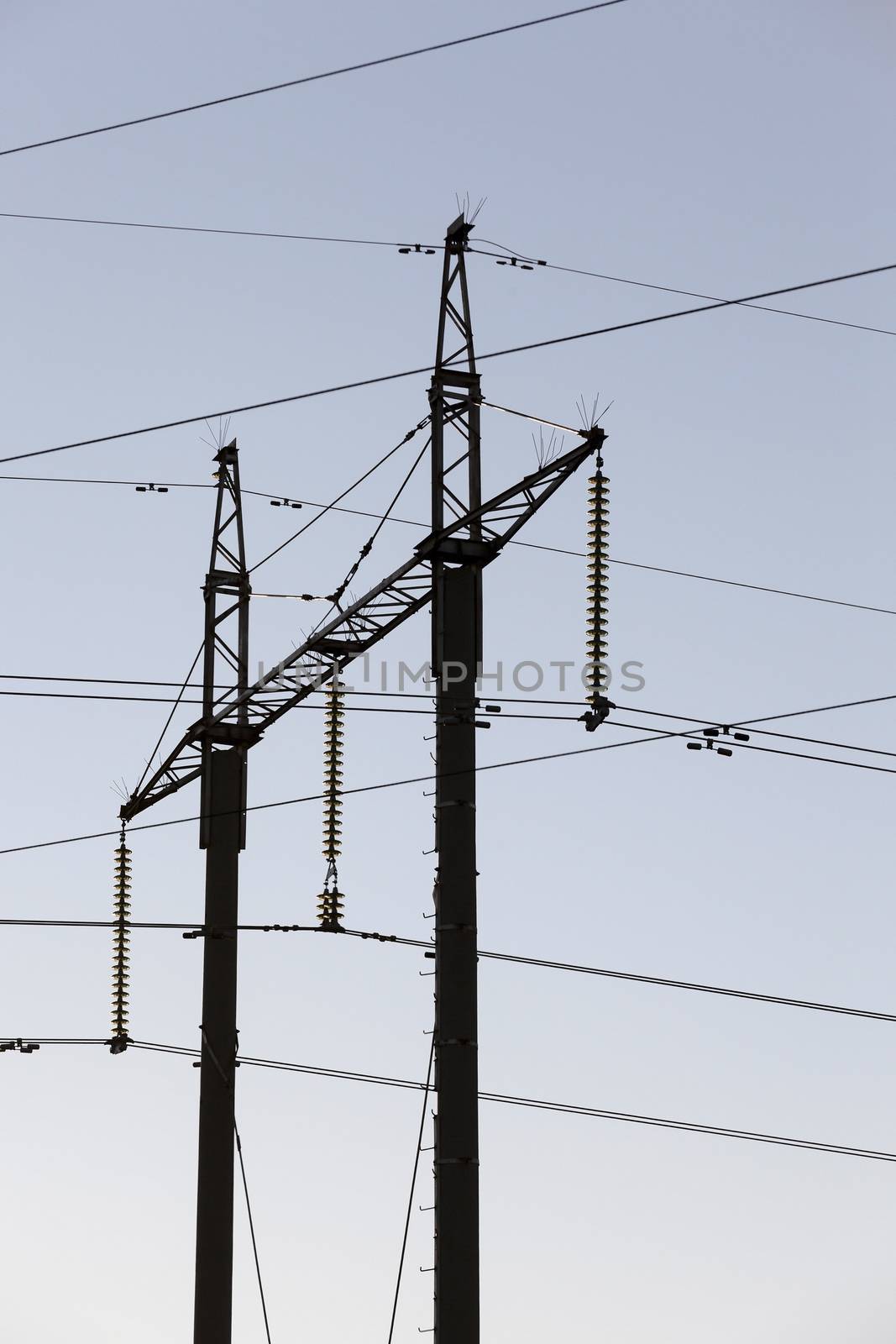 managed to picture the pillars, through which the high-voltage lines, daytime, sky,