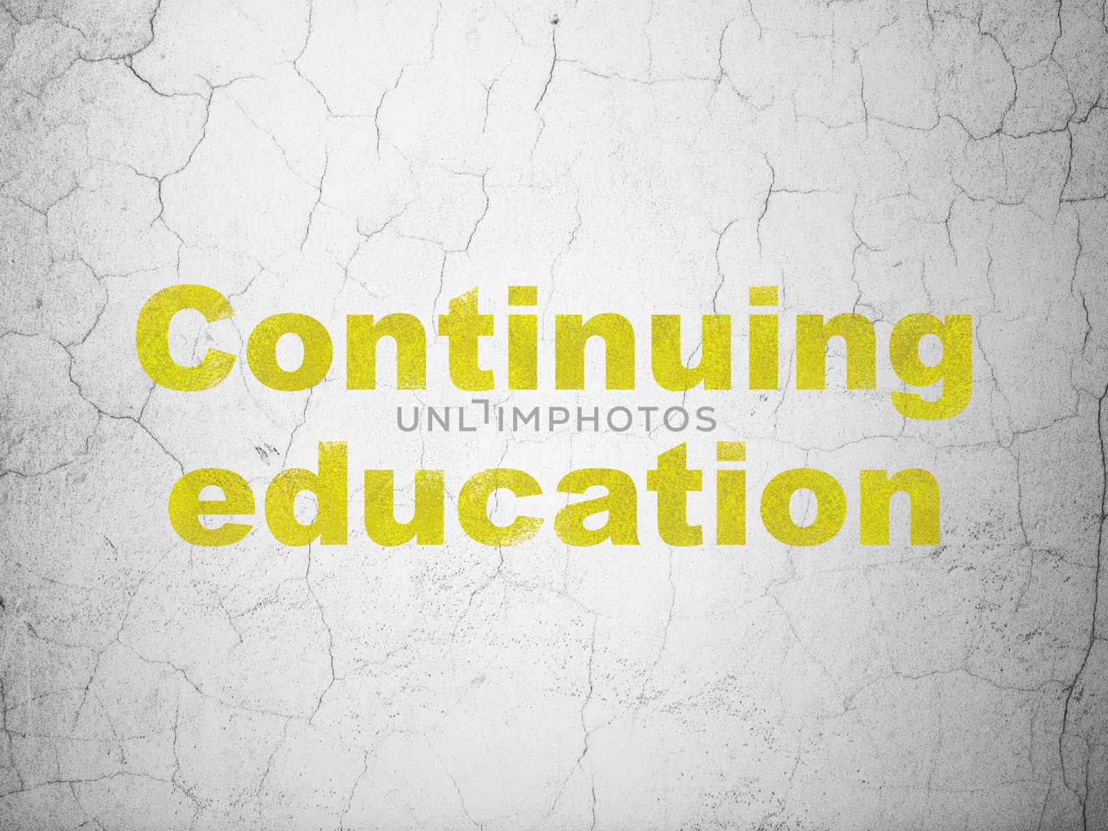 Studying concept: Yellow Continuing Education on textured concrete wall background