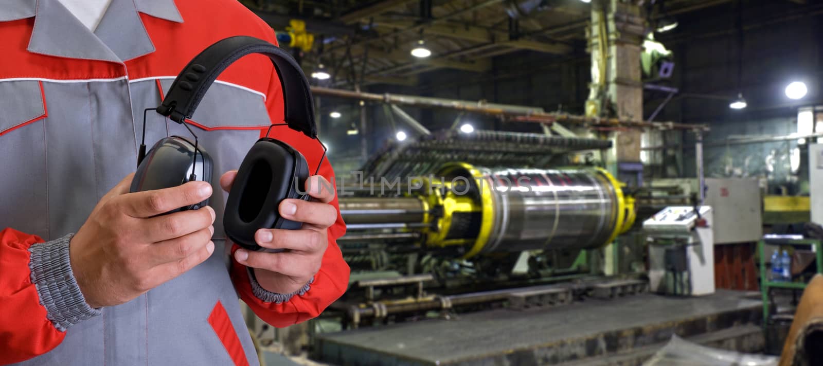 Worker with protective headphone by rusak