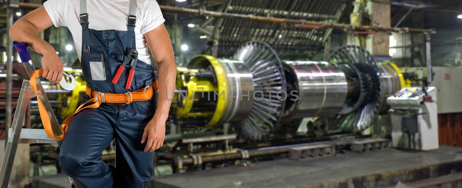 Worker with instruments at industrial factory