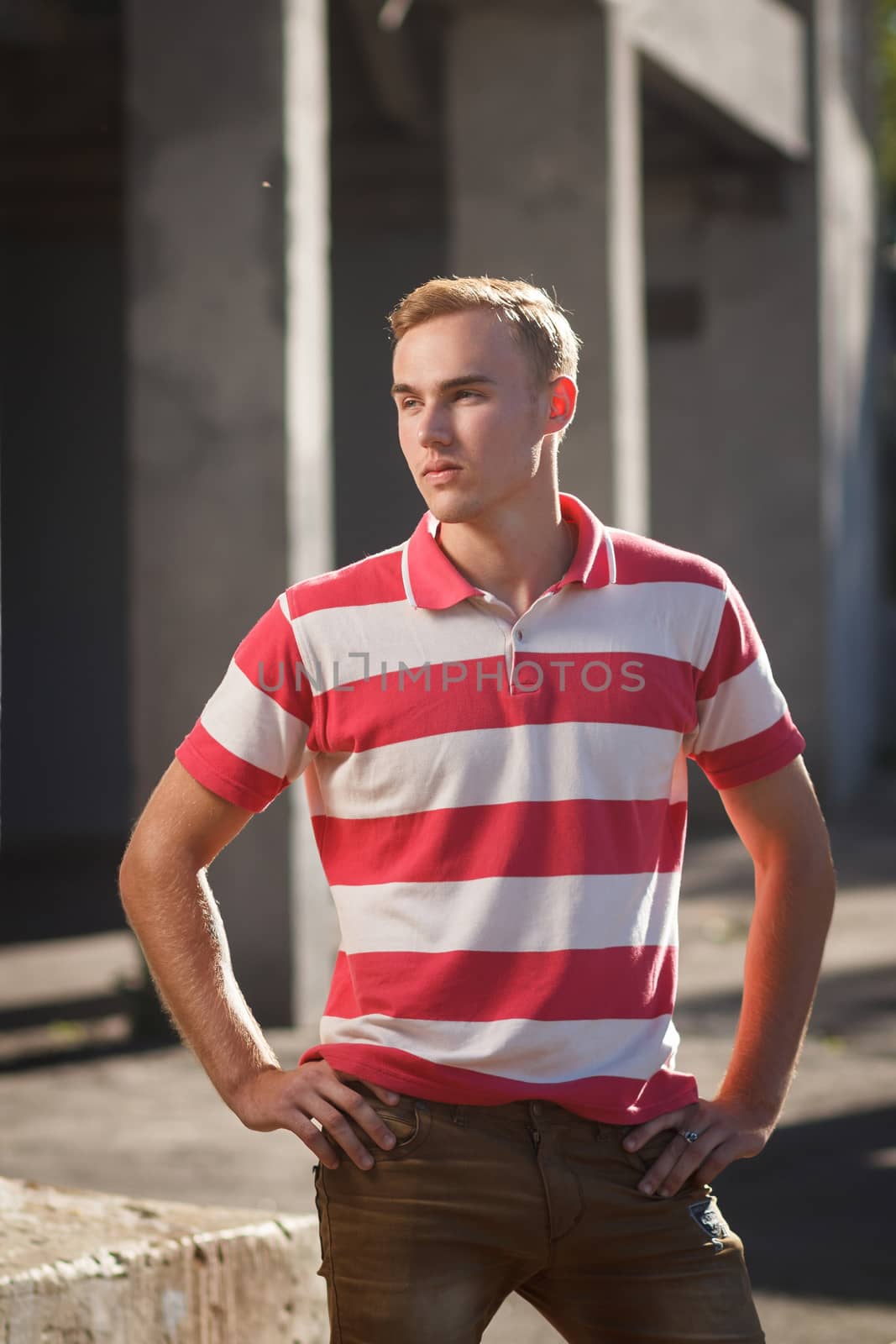 Handsome young man outdoor fashion shoot. Concept: beauty