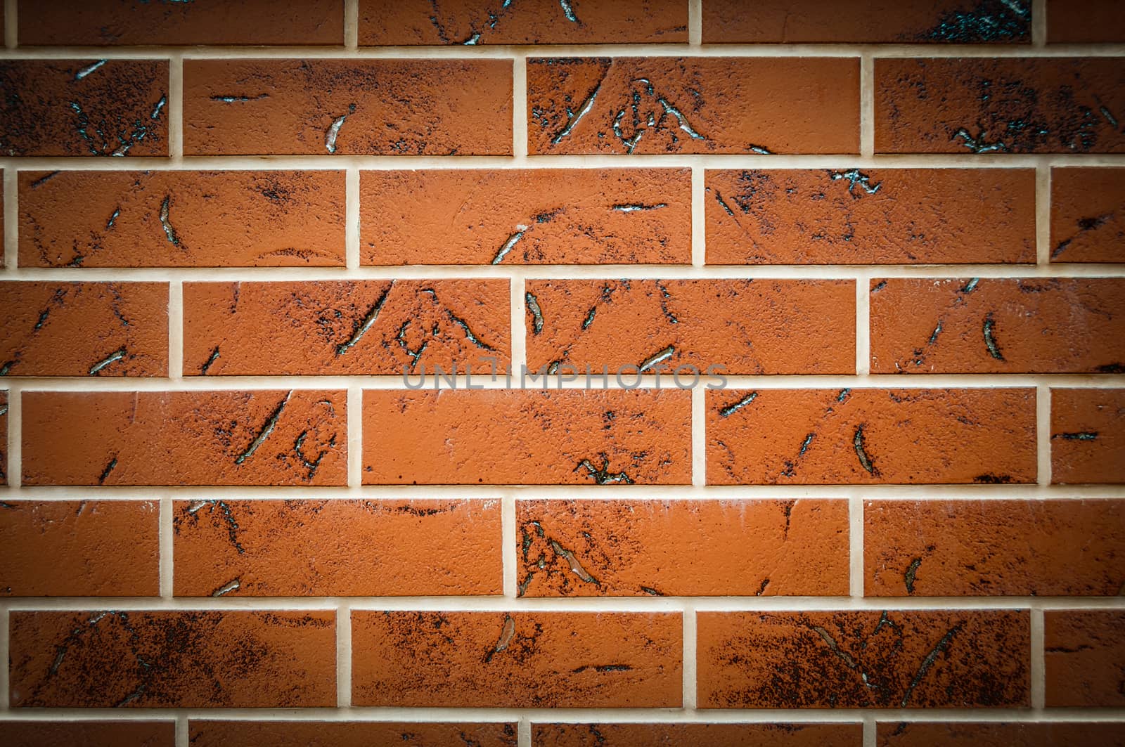 Brown texture tiles under brick background. Wall