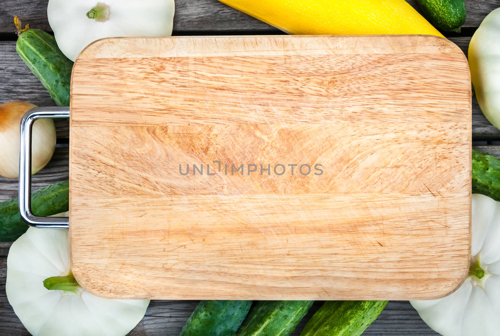 Cutting board, fresh vegetables on wooden table.  Top view with copy space.