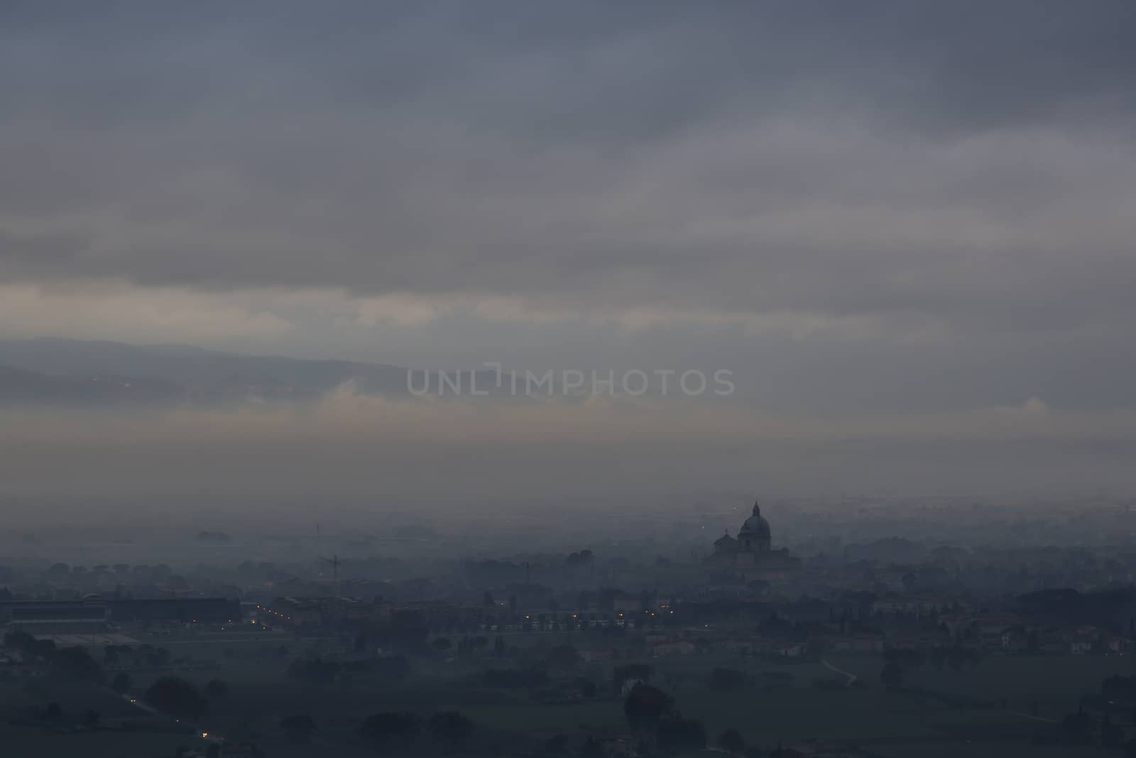 Distant view of a cathedral shrouded in fog