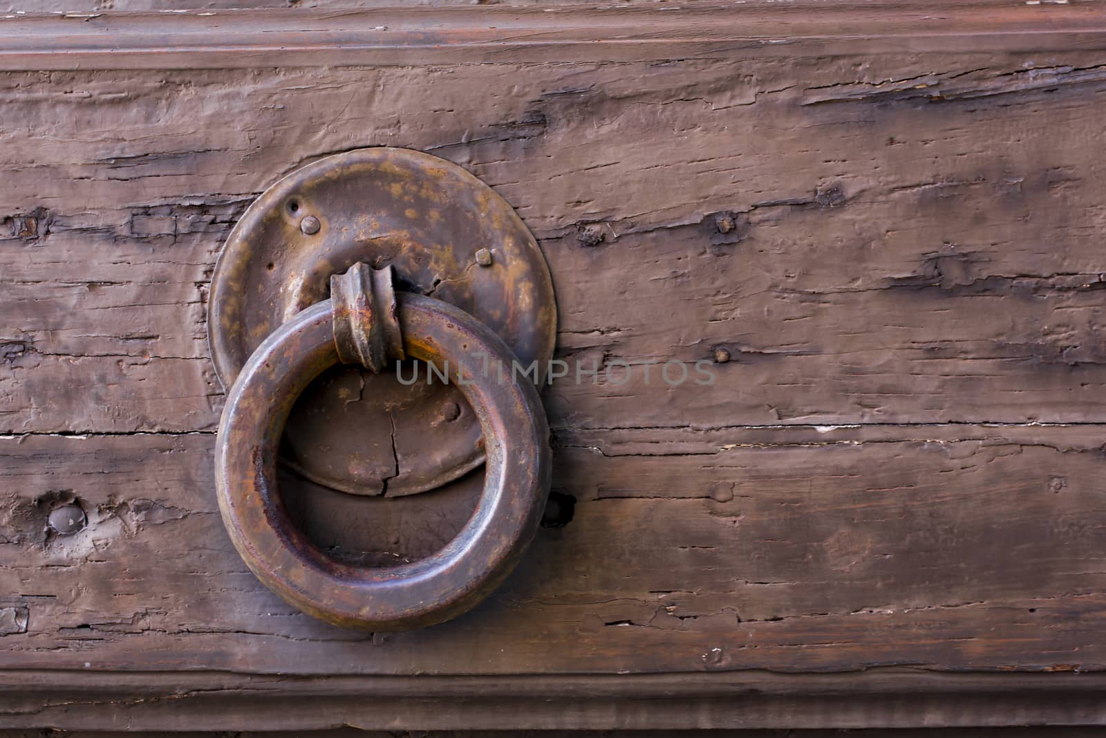 Close-up view of an ancient Tuscan iron knocker