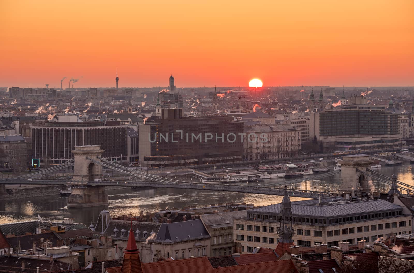 Rising Sun over Cityscape of Budapest with Chain Bridge over Danube River