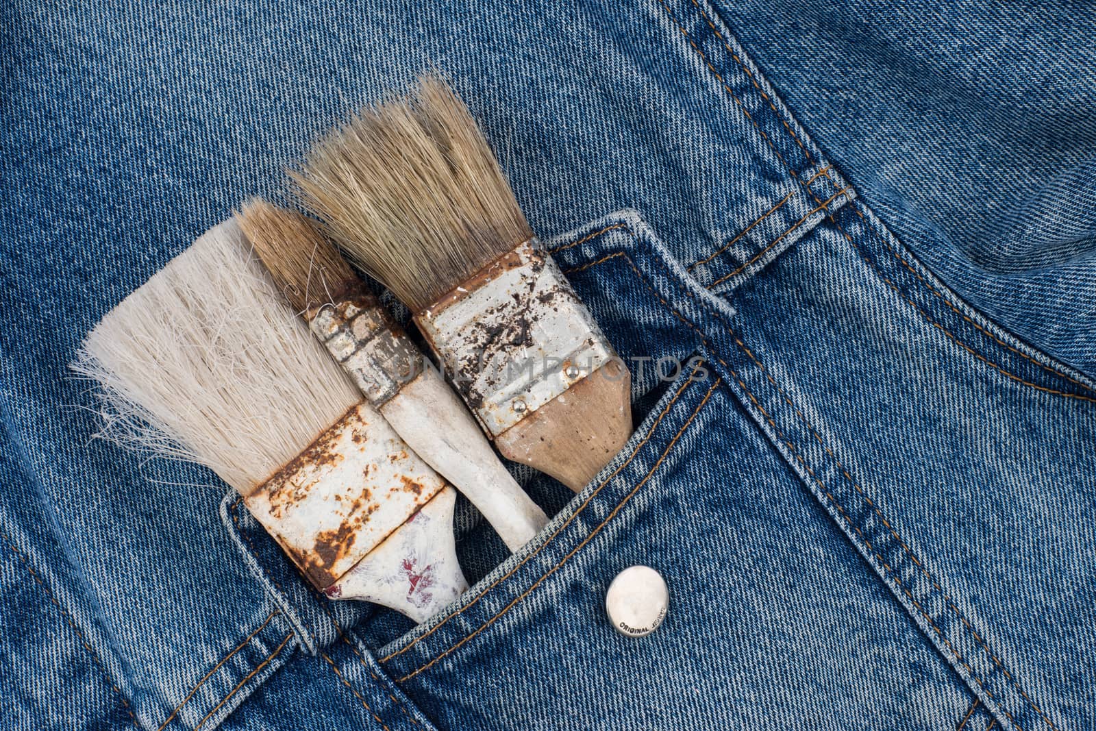 paint brushes in jeans pocket by DGolbay