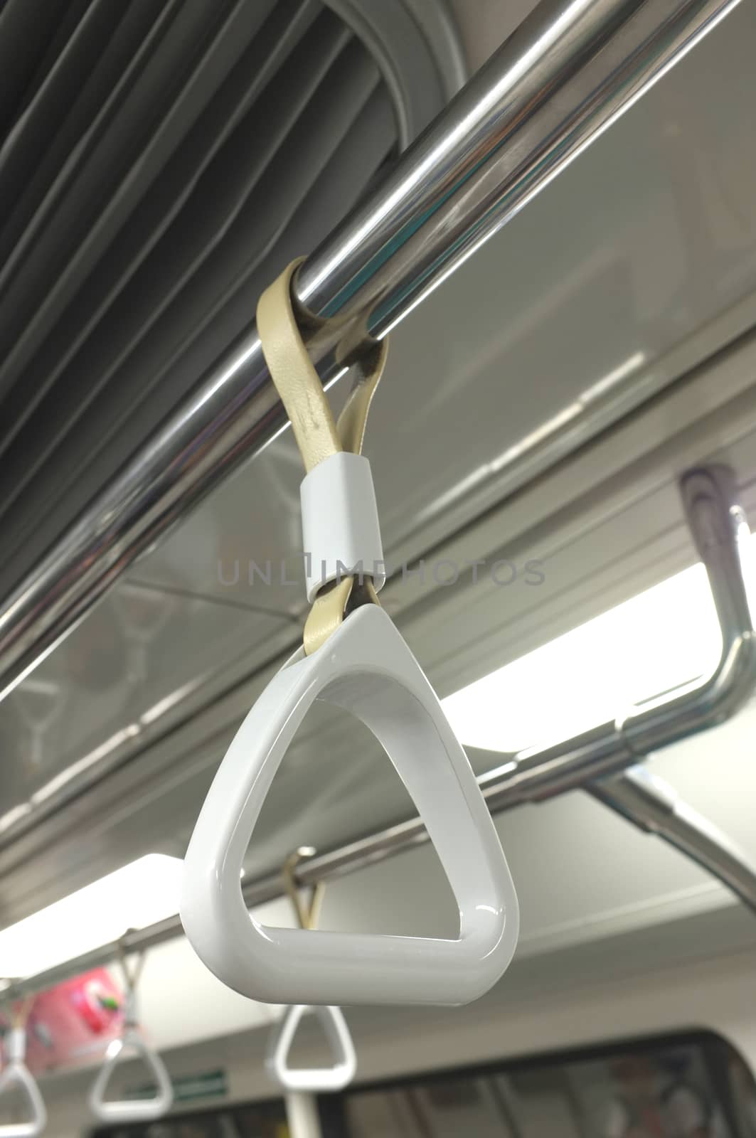 White handrail for passenger handling in train