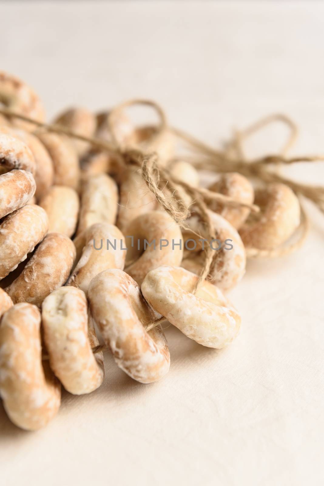 bundle of bagels on a white tablecloth in natural light