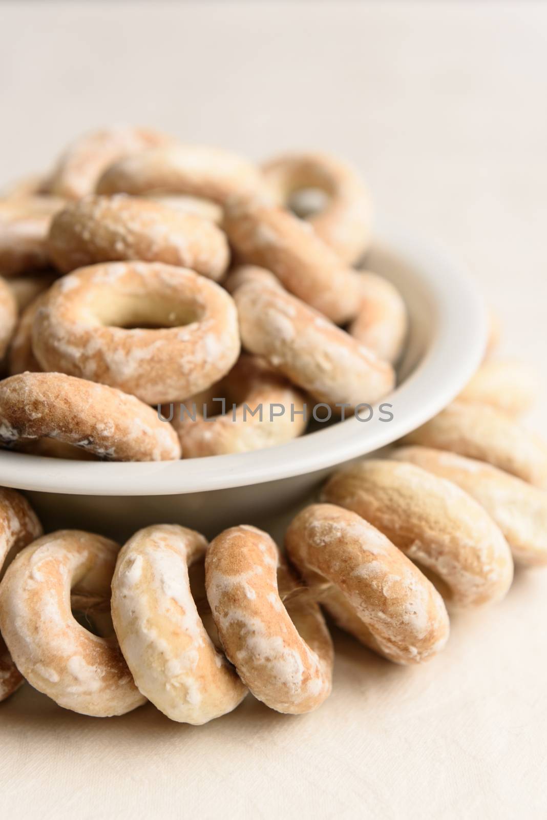 bundle of bagels on a white tablecloth in natural light