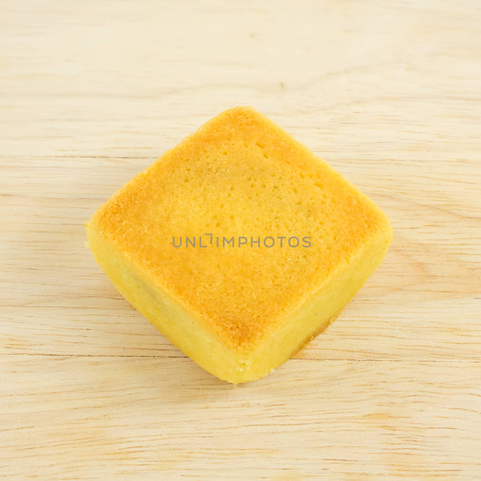 The tasty Taiwanese pineapple pastry cake on the wooden plank.