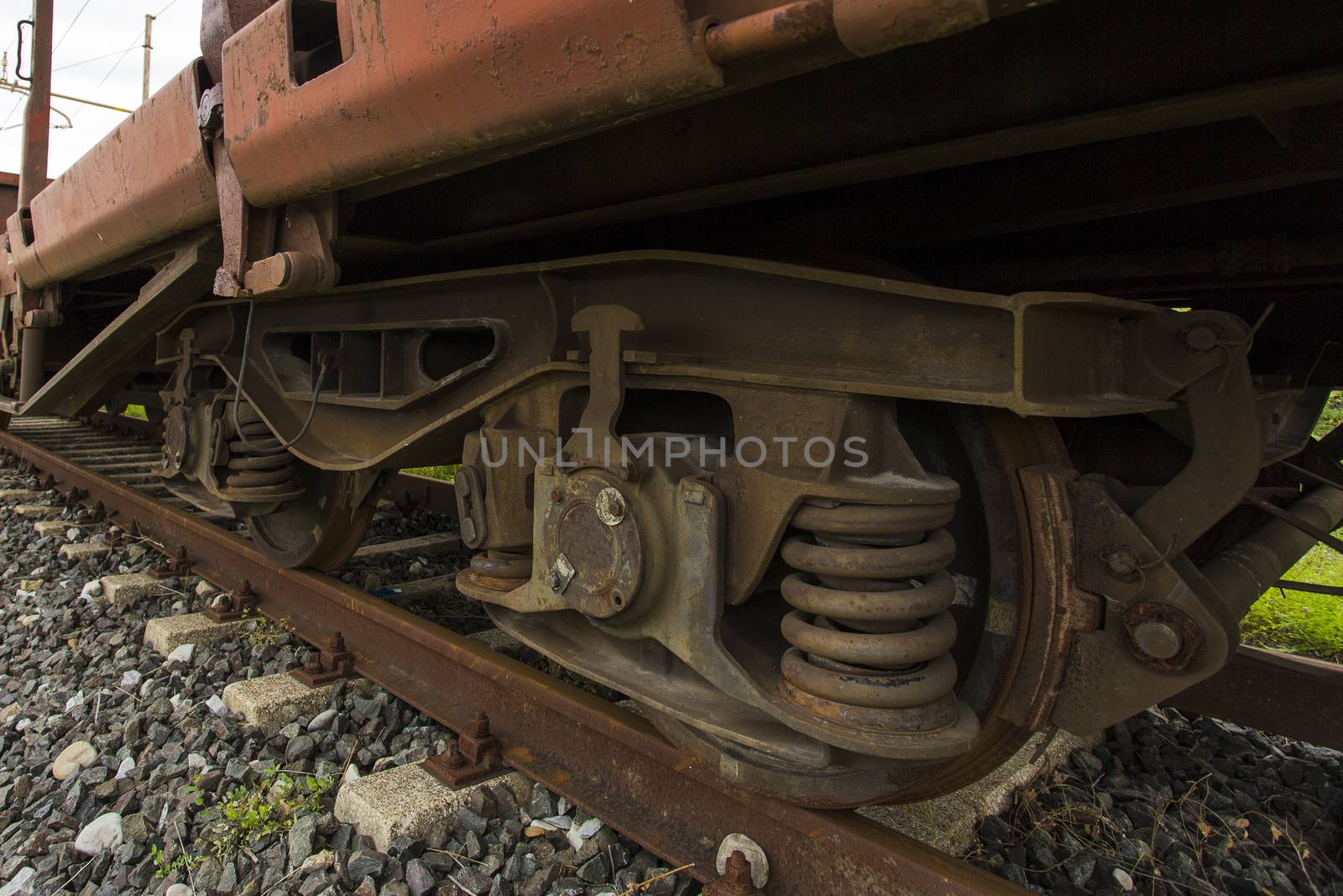 Closeup view diagonally of the wheels of a freight train