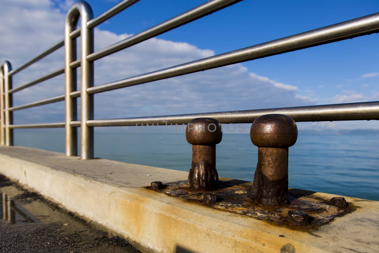 View of two old cleats of a pier marine eroded by salt