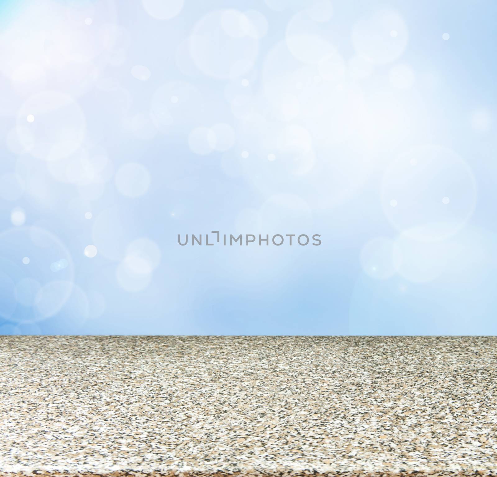 Marble board empty table in abstract blue background with bokeh. Perspective marble board over blurred blue background - mockup for display of product