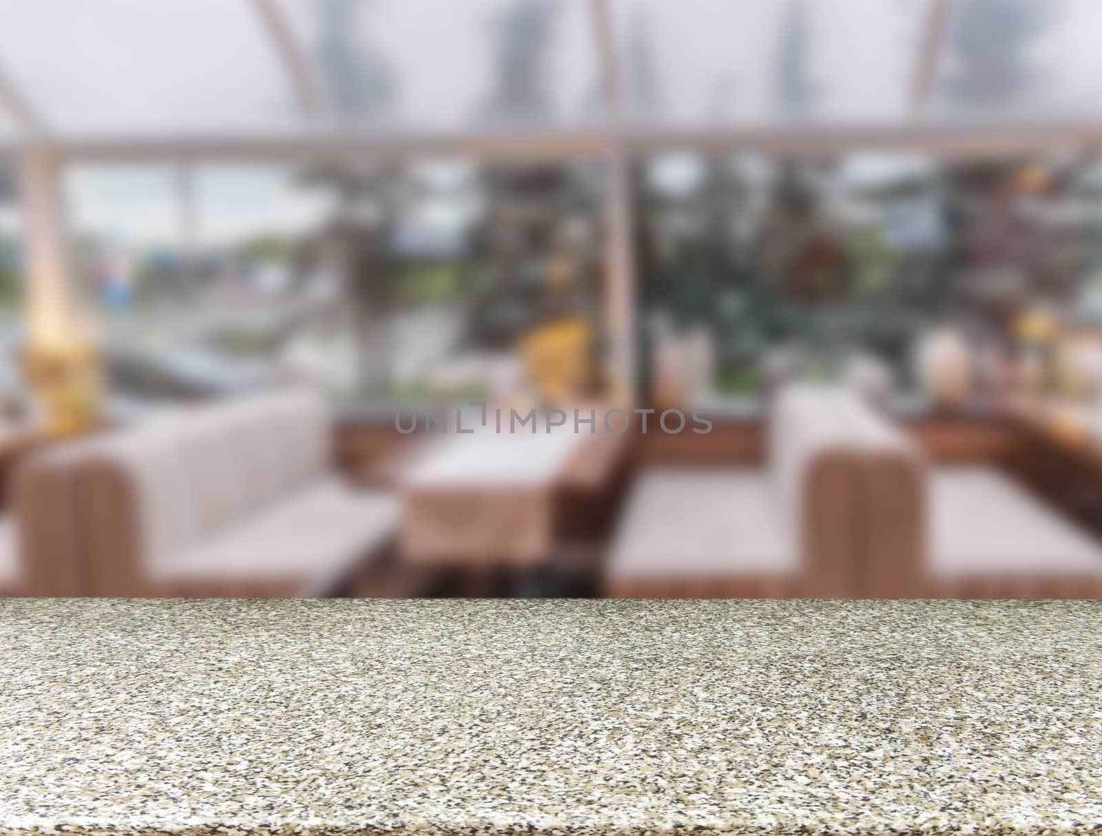 Marble board empty table in front of blurred background. Perspective marble table over blur in cafe interior - can be used for display or montage your products. Mockup your products