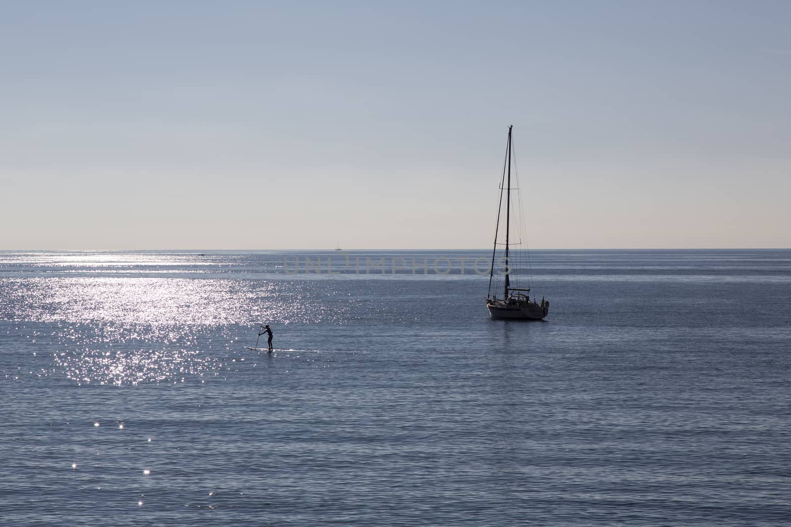 Panoramic view of an Italian seaside landscape on a sunny day with a boat on the horizon