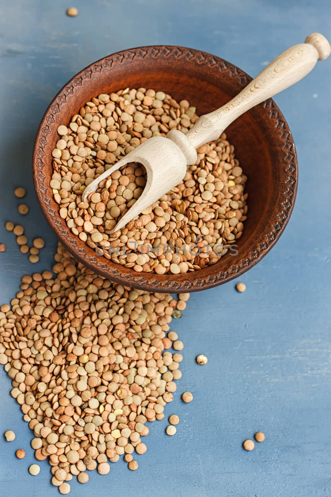lentils on a wooden table . selective focus