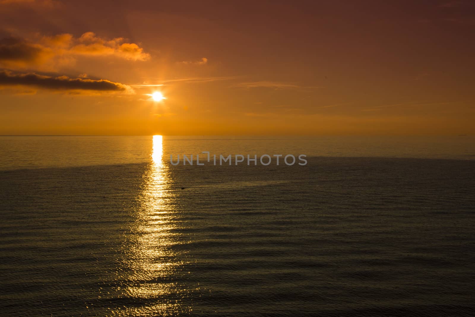 View of the sea on the horizon and the sun is setting
