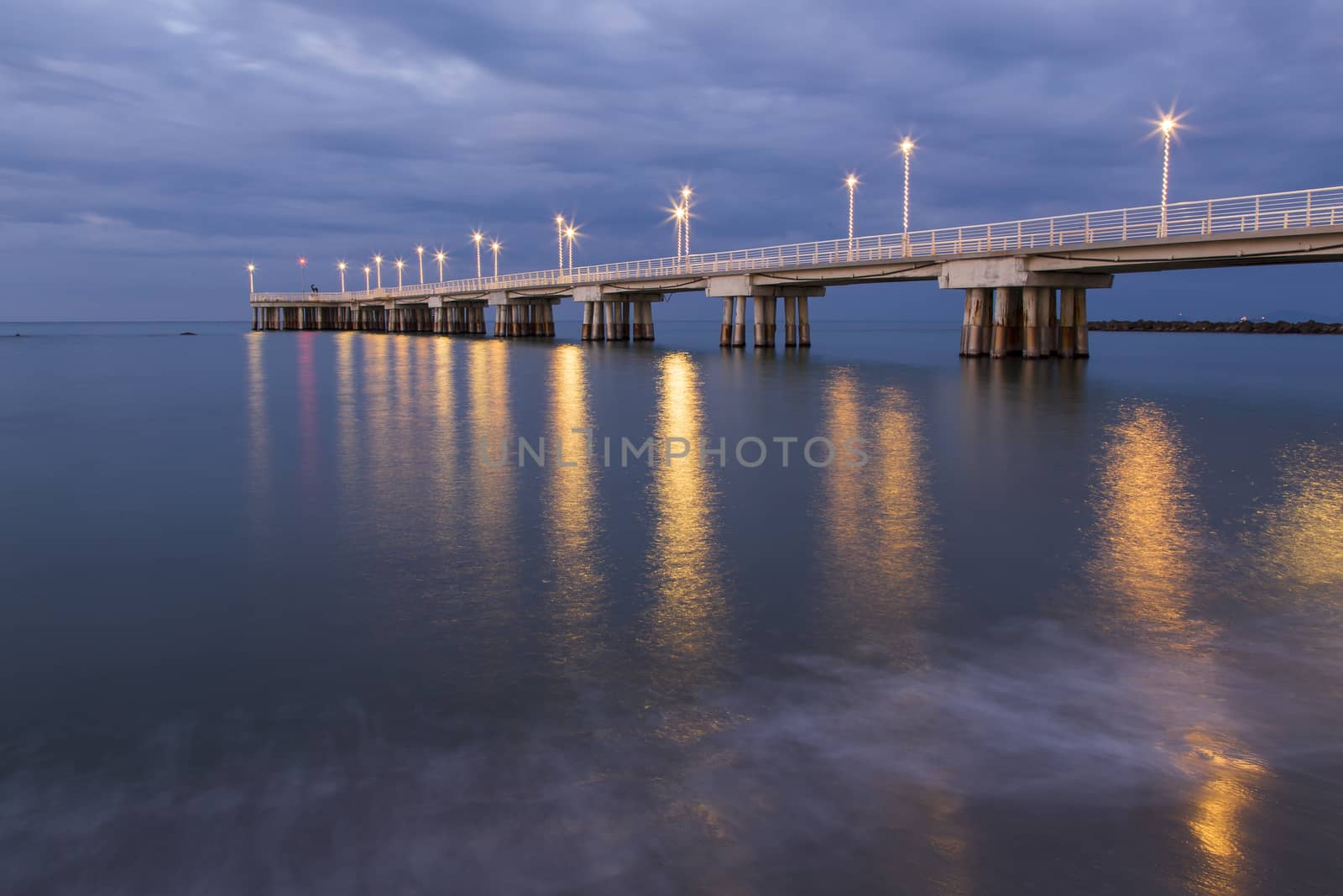 Panoramic view of a pier decorated with Christmas lights