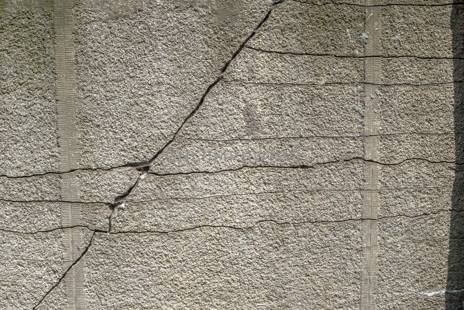 cracks in old concrete wall, abstract concrete, landscape style, grunge concrete surface, great background or texture by uvisni