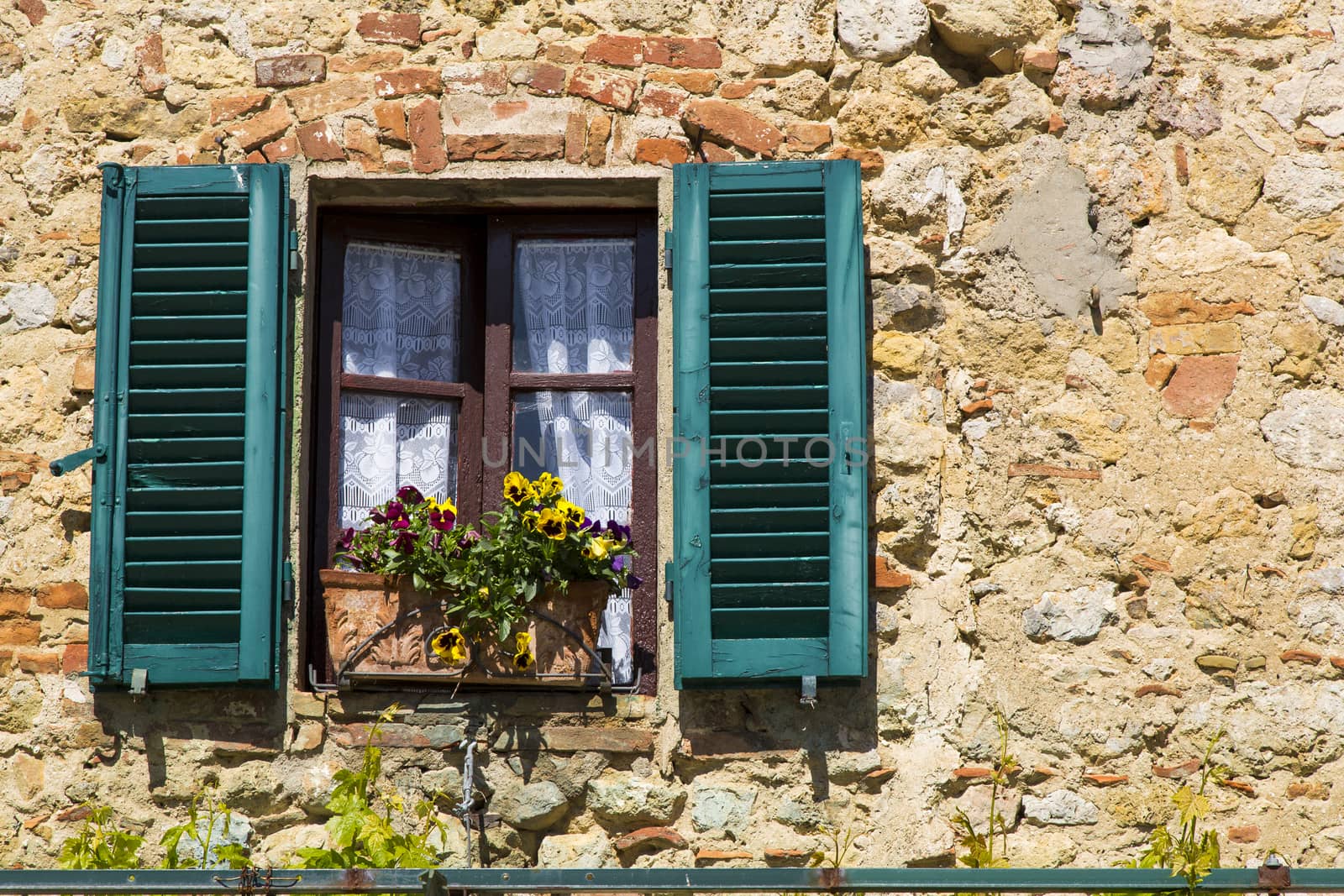 view from a window of an old house in a Tuscan village