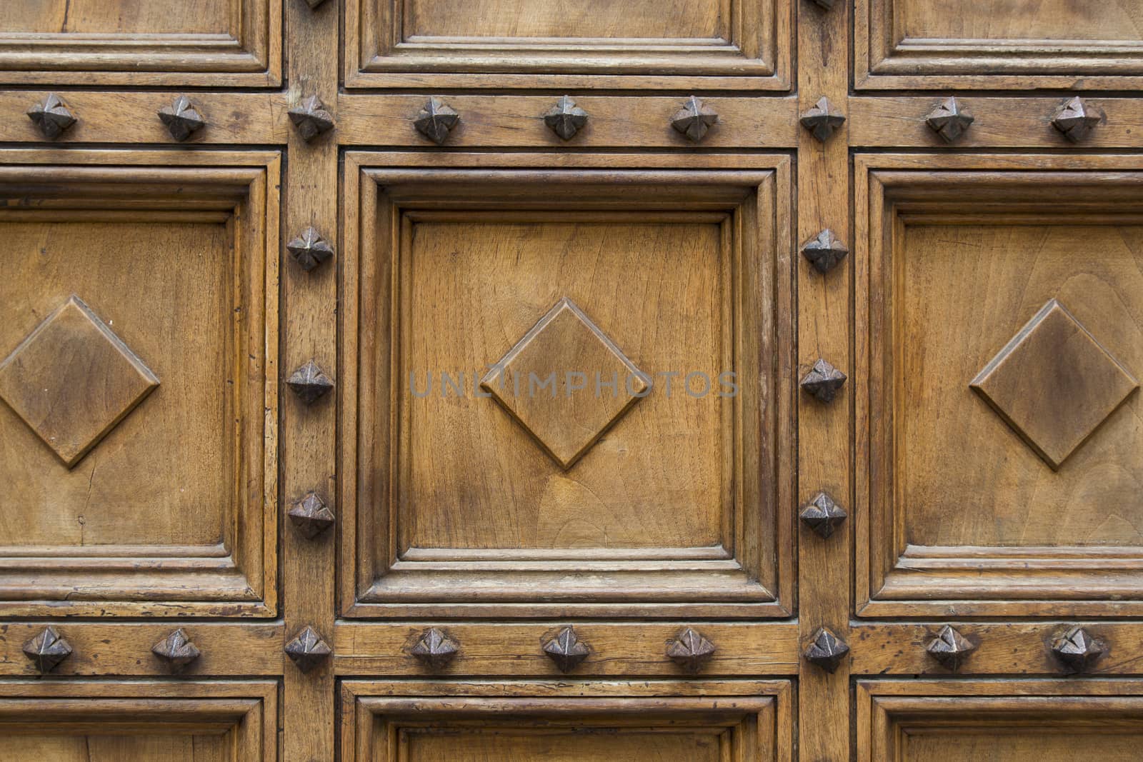 close-up view of a detail of a wooden door of a large ancient church