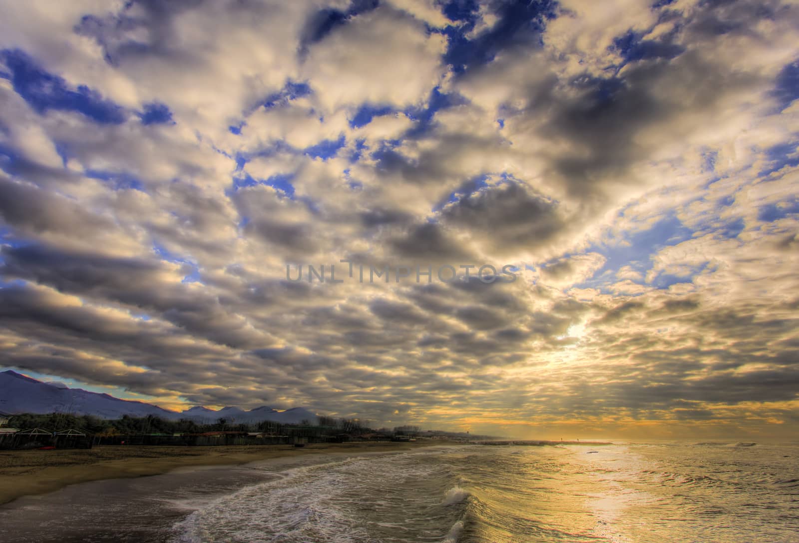 View from the beach of clouds at dawn