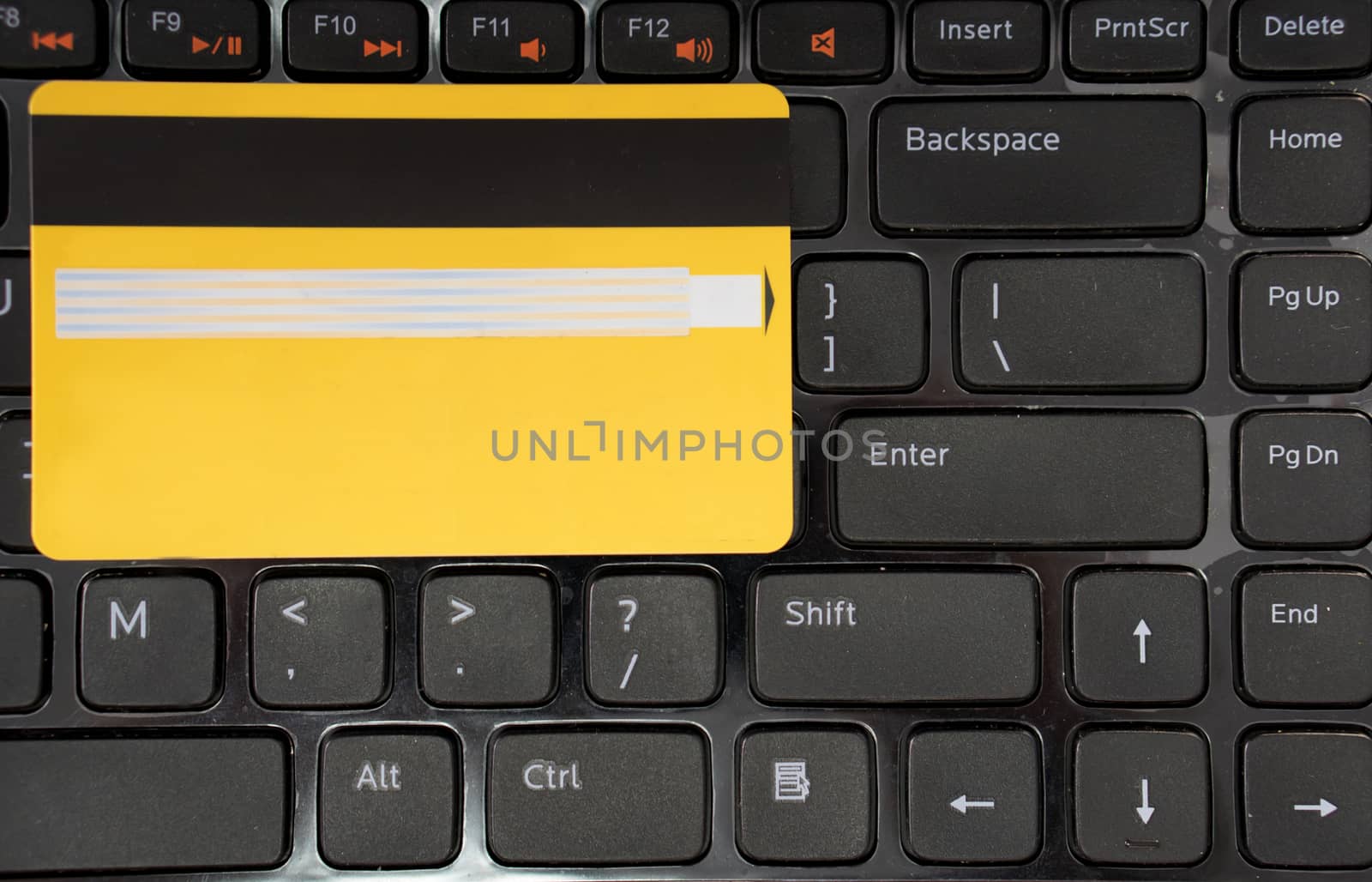 Computer generated image credit card on laptop's keyboard. Electronic commerce concept.