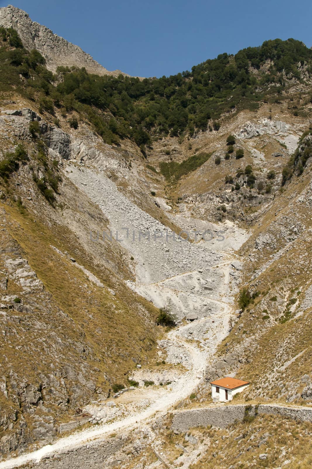 Mountain gorge with old road to the manual transport of marble