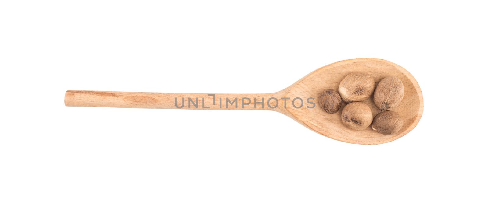 Nutmeg in wooden spoon by DGolbay