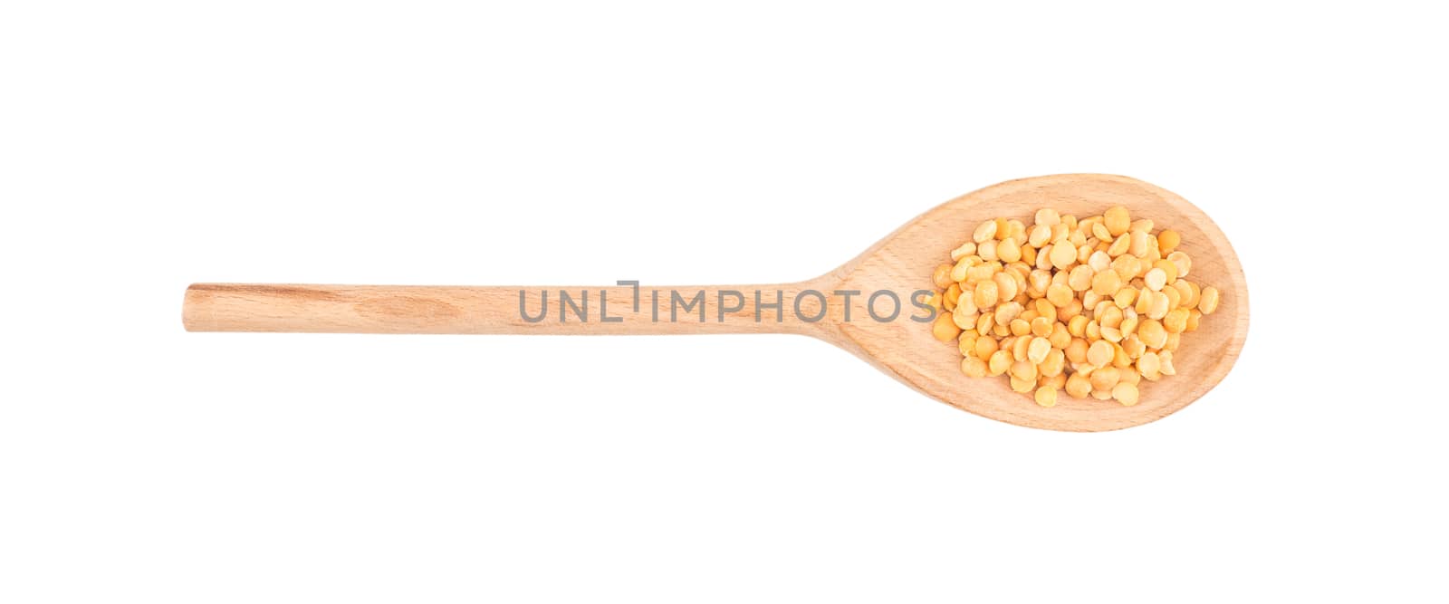 Dried peas in a wooden spoon on a white background by DGolbay