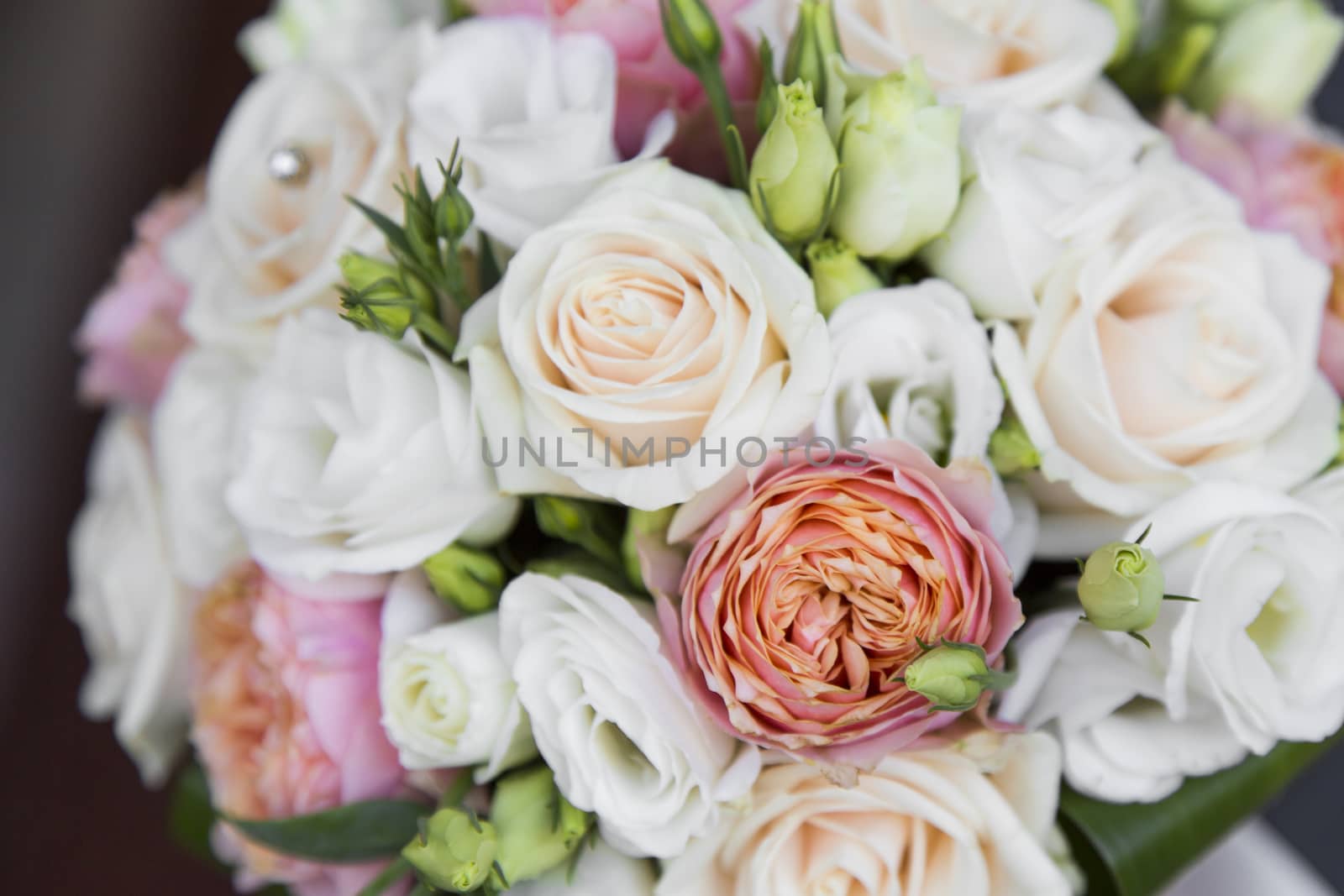 Close-up view of a bridal bouquet made of roses pale roses