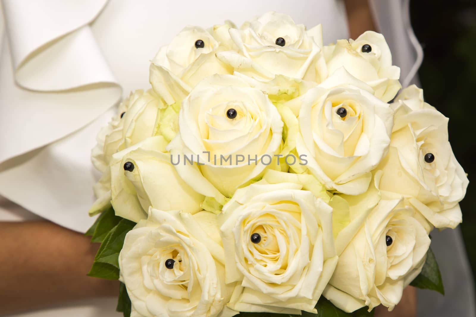 Close-up view of a bridal bouquet made of roses pale yellow