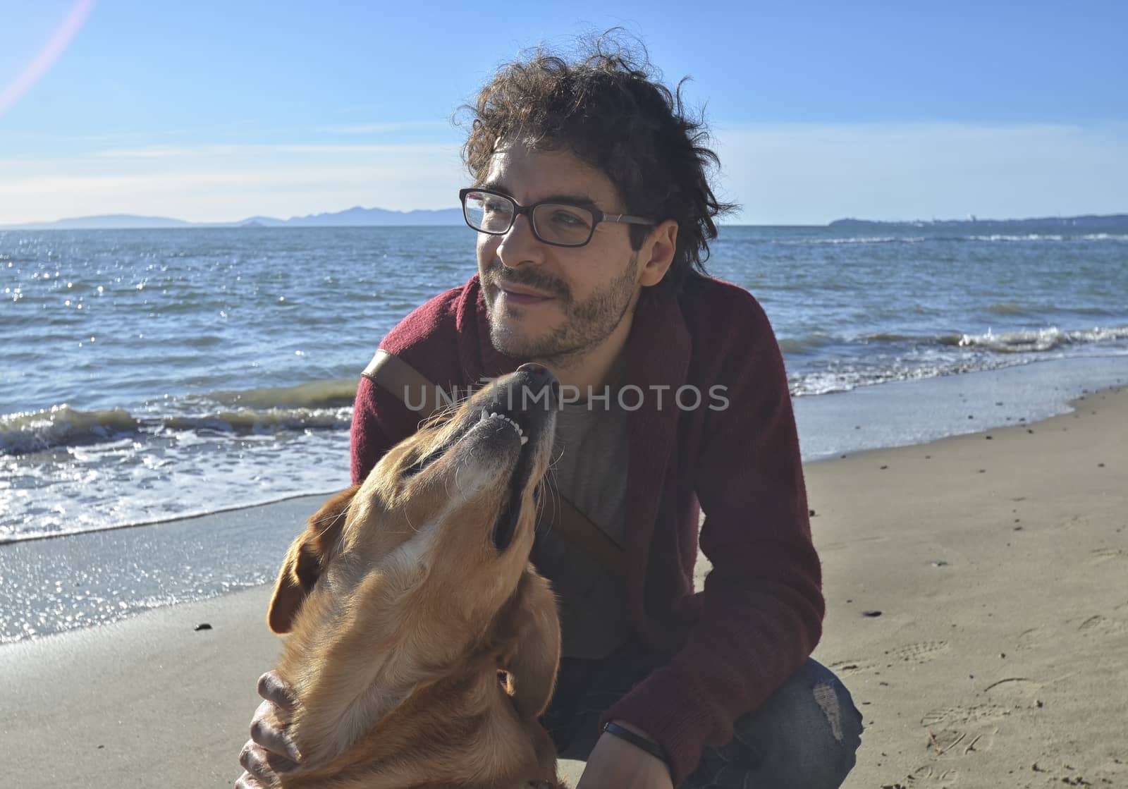 Man and his dog on the beach