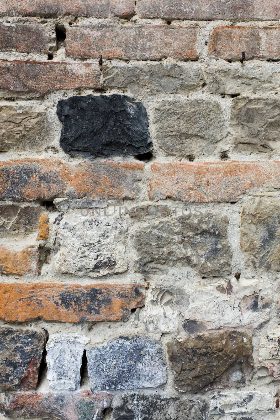 View a detail an ancient wall with black stone