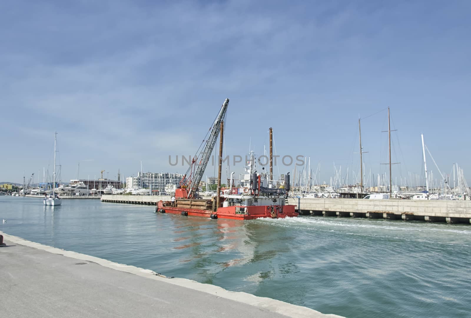 View of a dredger coming into Rimini port