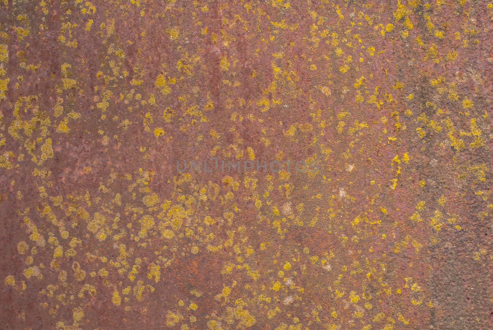 rusty iron surface covered with old chipped paint, which has long been influenced by different climatic conditions