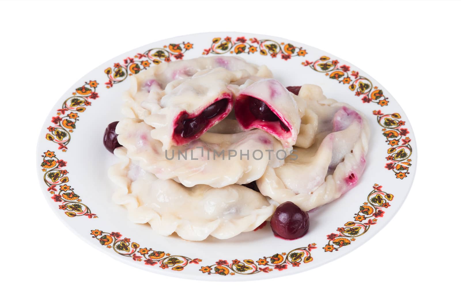 Ukrainian dumplings with cherries on plate on white background, isolated
