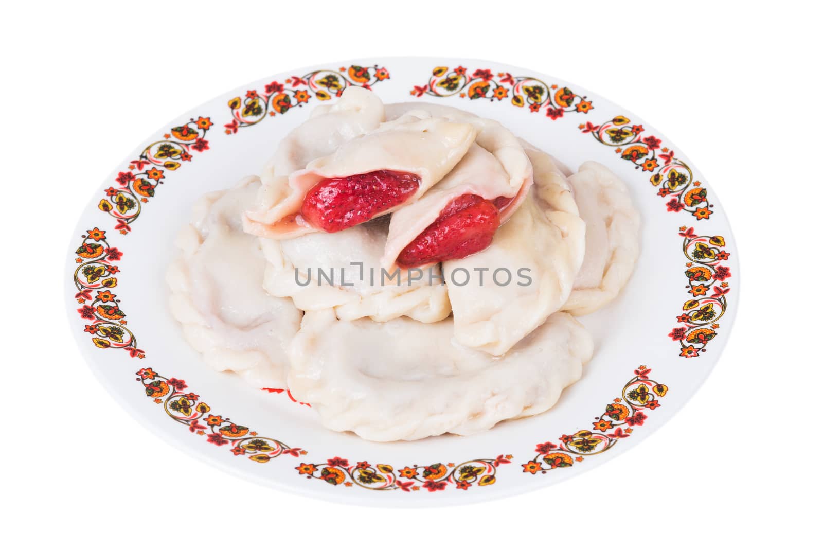 Ukrainian dumplings with strawberries on plate on white background, isolated