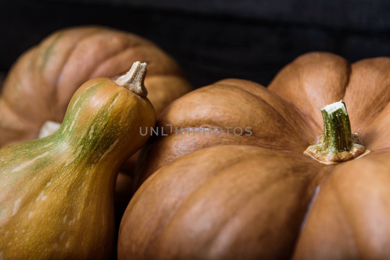 pumpkins lying on a wooden table