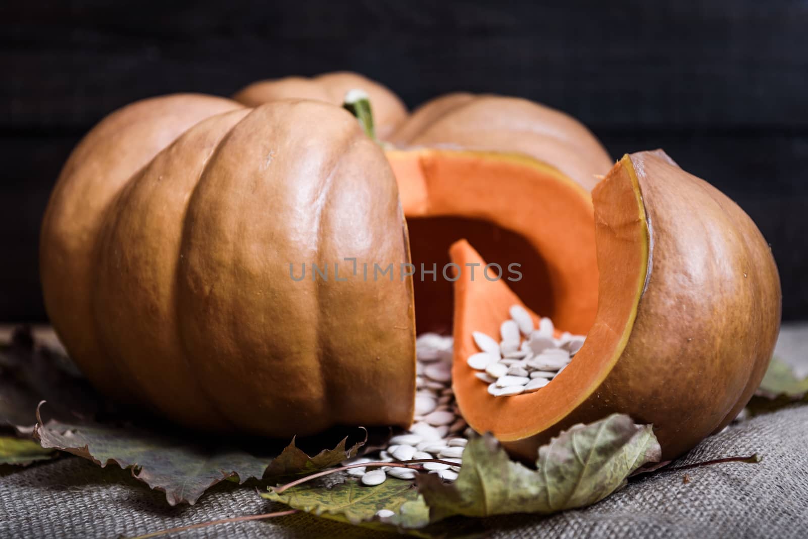 pumpkin lying on a wooden table by Andreua