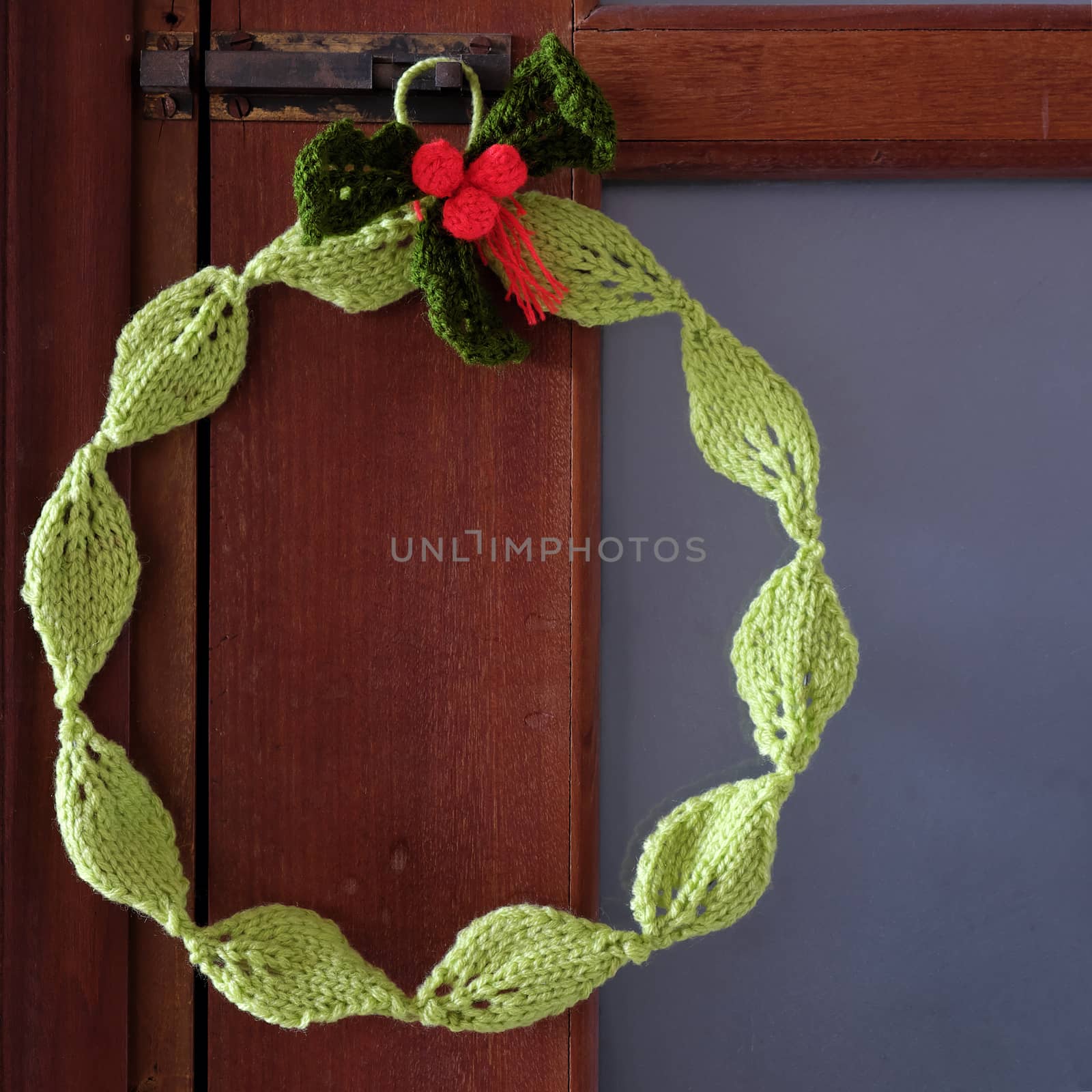 Diy Christmas wreath for decoration the door on Xmas holiday, a traditional festive in winter,  wreath make from knitted green leaf