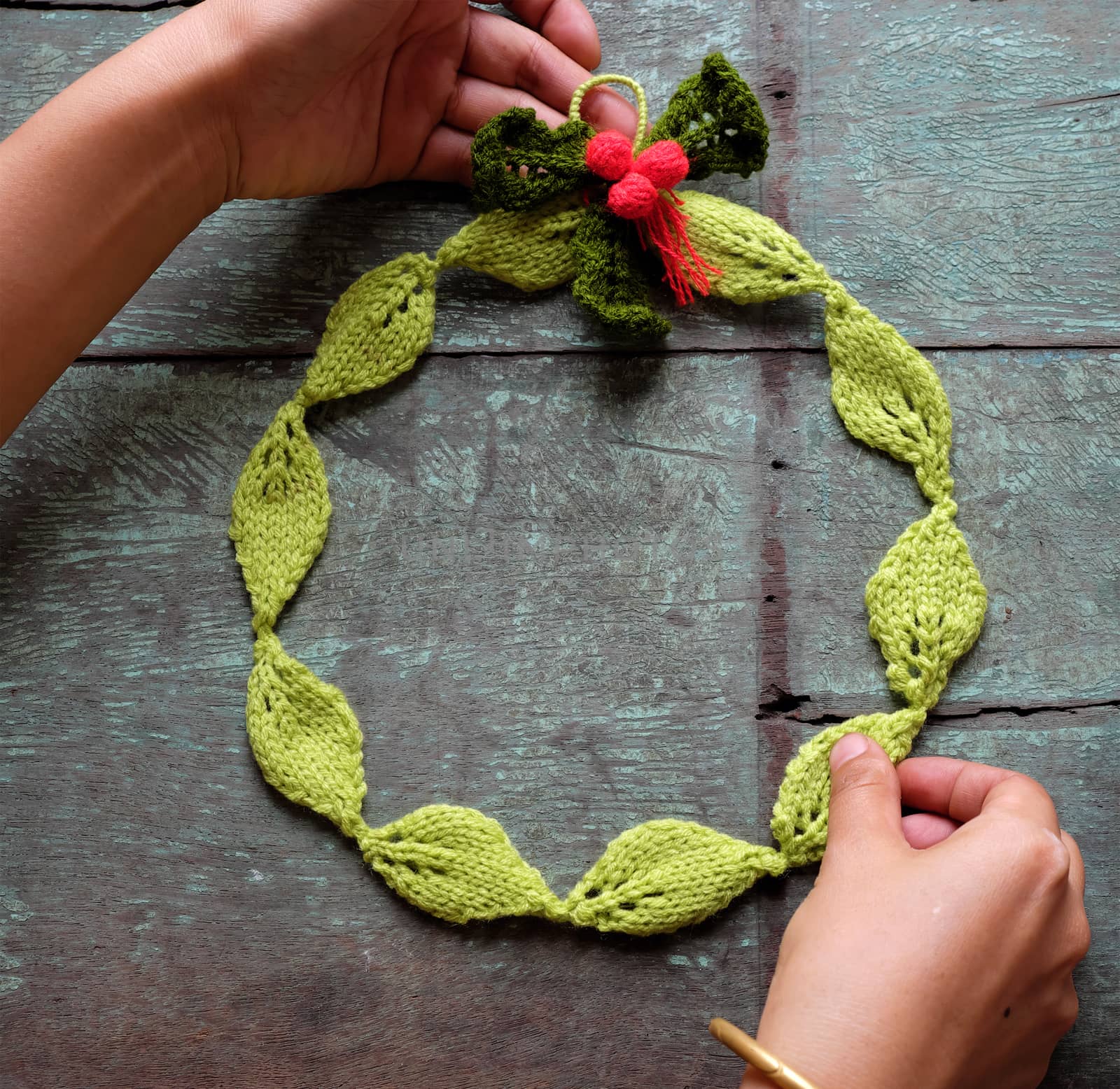 Diy Christmas wreath for decoration the door on Xmas holiday, a traditional festive in winter,  wreath make from knitted green leaf