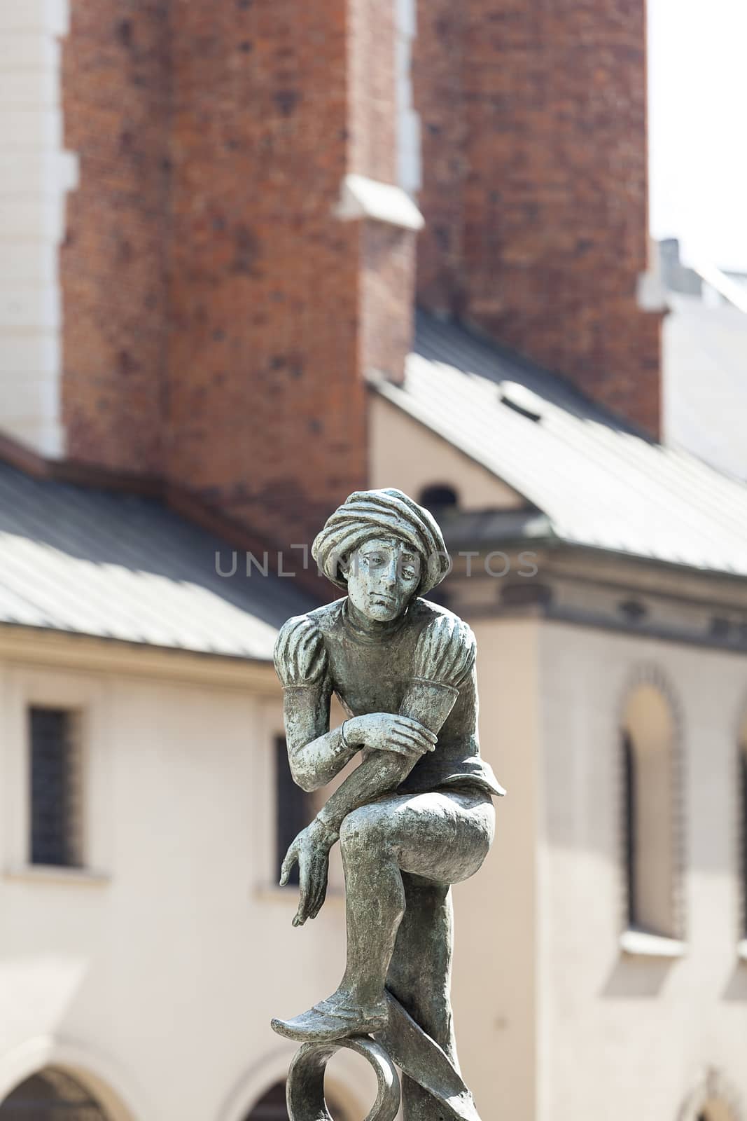 Figurine student, a copy of the form from the altar of Veit Stoss,  fountain in the square of St. Mary's, Krakow, Poland