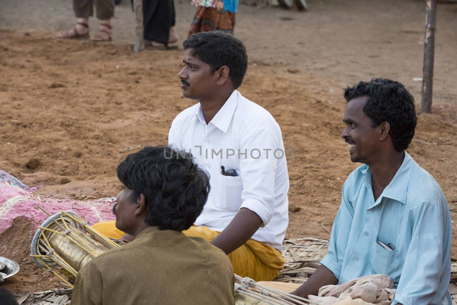 Pondicherry, Tamil Nadu,India - May 15, 2014 : each year in villages, people celebrate the temple fest, for the full day. They walk in groups, they launch paint on people, play music.