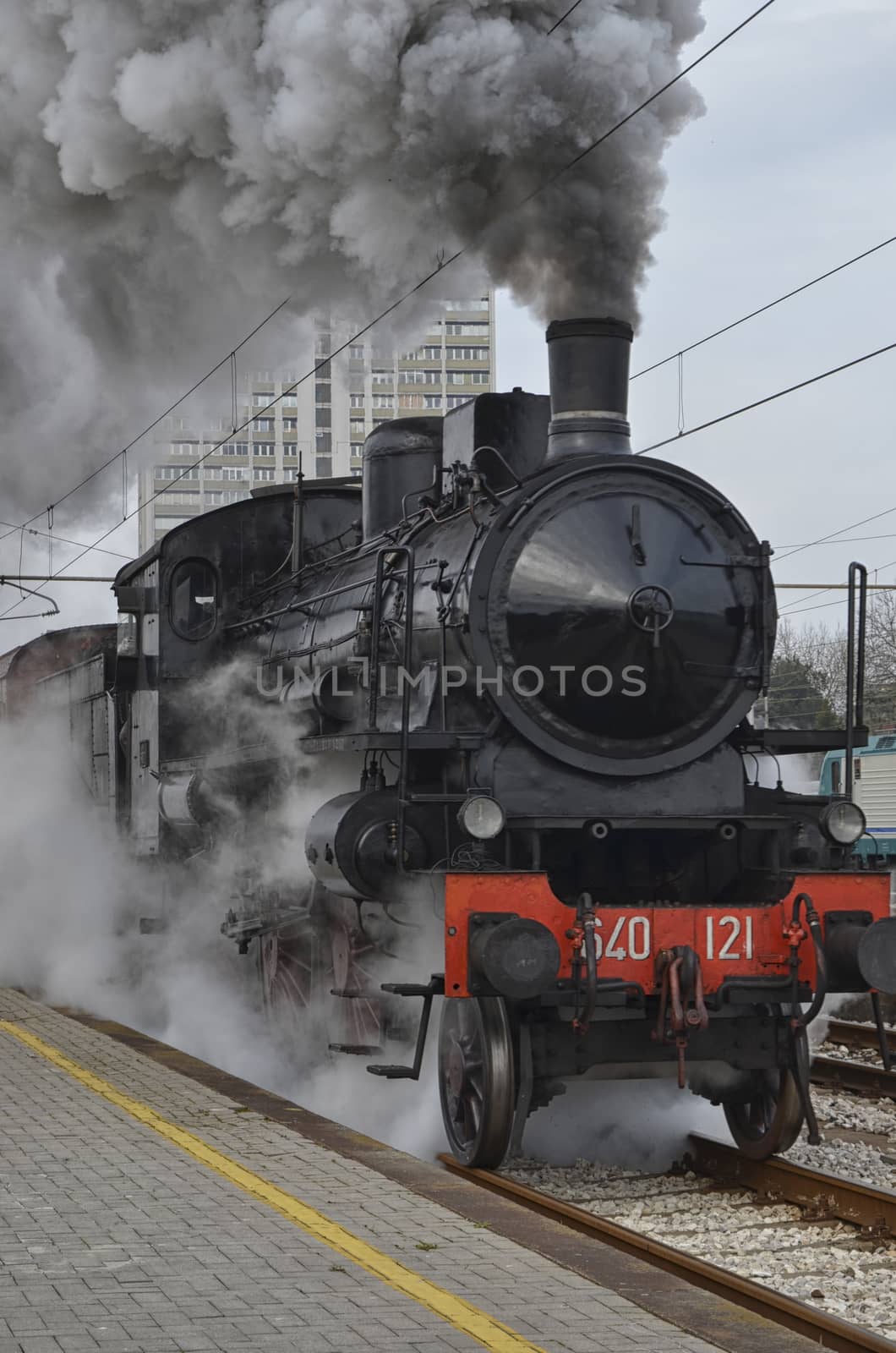 View of classic train in clouds of smoke