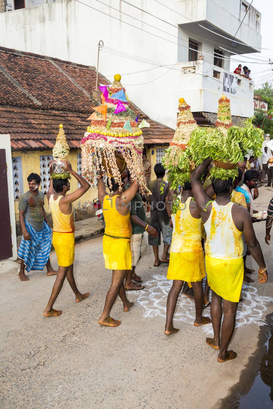 Pondicherry, Tamil Nadu,India - May 15, 2014 : each year in villages, people celebrate the temple fest, for the full day. They walk in groups, they launch paint on people, play music.